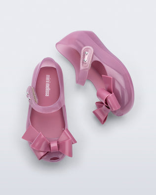 Top and side view of a pair of lilac Ultragirl Classy baby ballerina flats with lilac bow