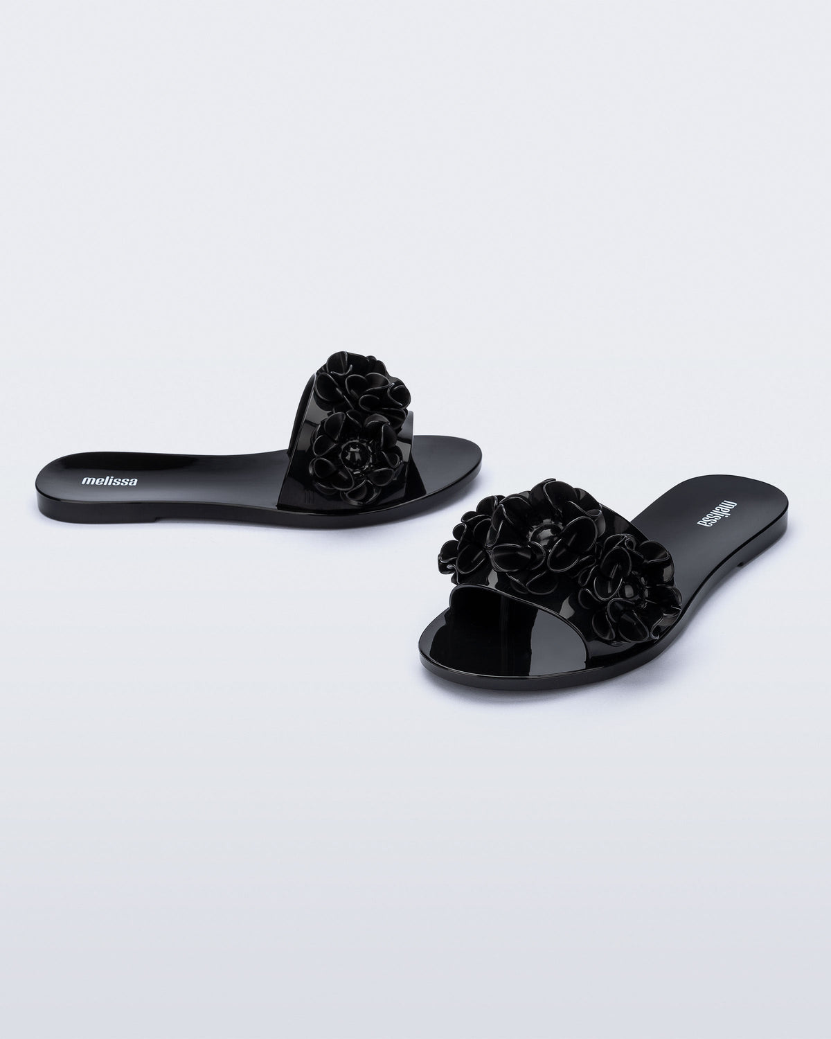 Angled view of a pair of black Babe Springtime slides.