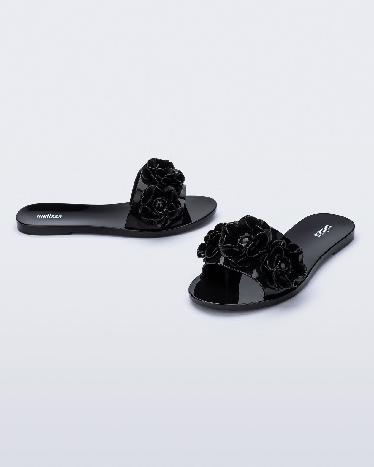 Angled view of a pair of black Babe Springtime slides.