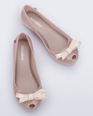 Top view of a pair of pink kids Ultragirl Bow flat