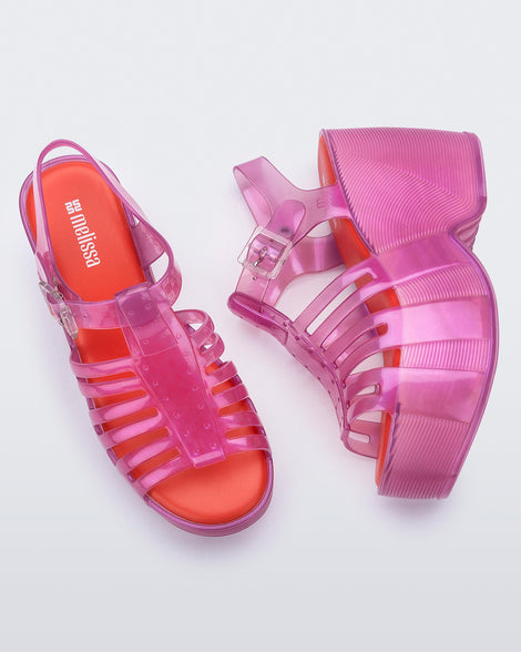 Top and side view of a pair of pink Station 79 platform heels with ankle straps