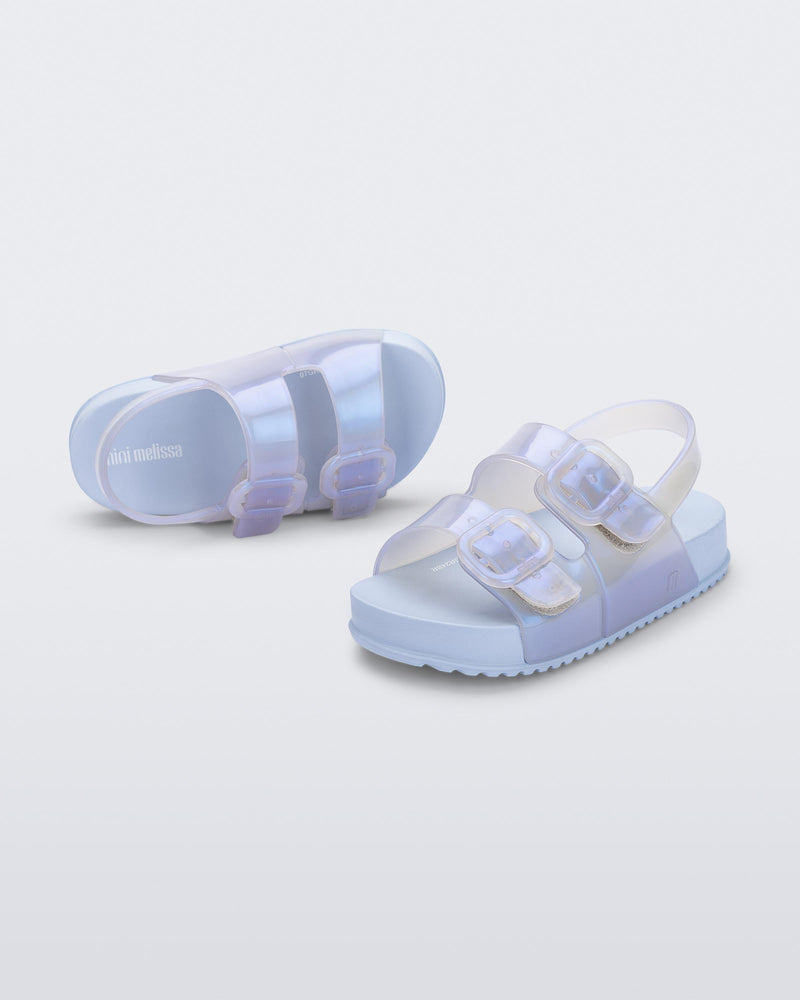 Angled view of a pair of pearly blue Cozy Sandals