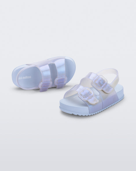 Angled view of a pair of pearly blue Cozy Sandals