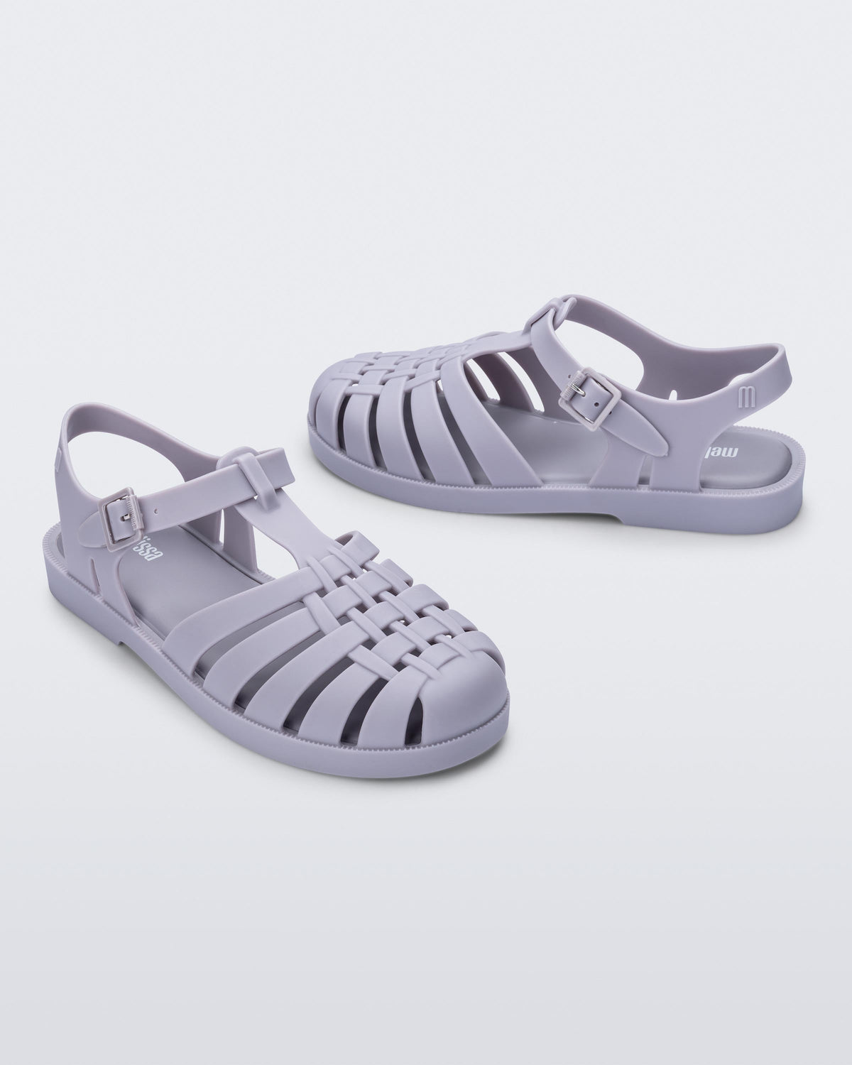 Side angled view of a pair of grey Possession sandals