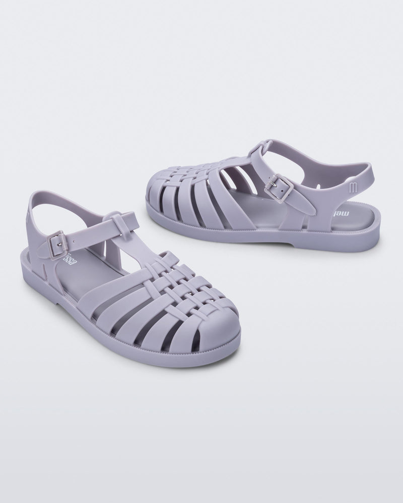 Side angled view of a pair of grey Possession sandals