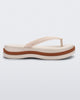 Side view of a beige/brown Melissa Leblon platform flip flop with details that mimic sisal braids on the sole and strap