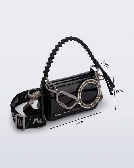 Angled view of an black Olga Bag + Alexandre Pavao with short strap fabric long  strap. With purse dimensions of 18cm x 7cm x 13cm
