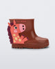 Side view of a brown Welly Wonderland baby boot with orange pony on side
