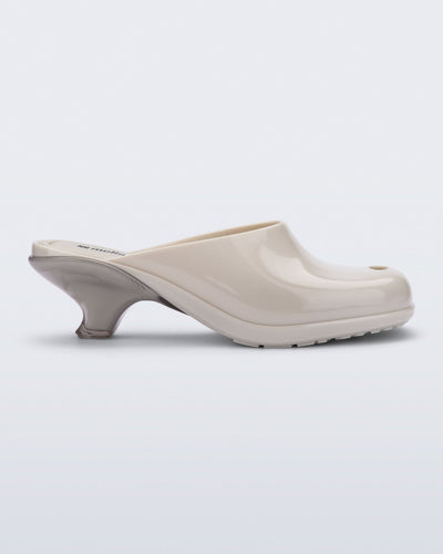 Side view of a light beige Gaia kitten heel with peep toe