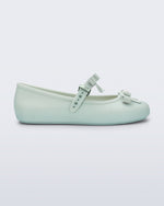 Side view of a green Soft Ballerina Bow with bows and a pearl in the center of each bow