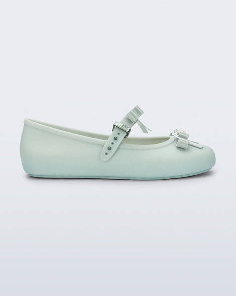 Side view of a green Soft Ballerina Bow with bows and a pearl in the center of each bow
