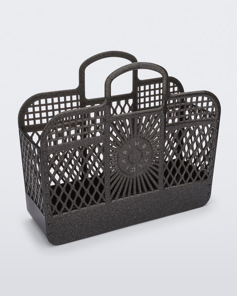 Angled view of the glitter black Bag + Bimba y Lola