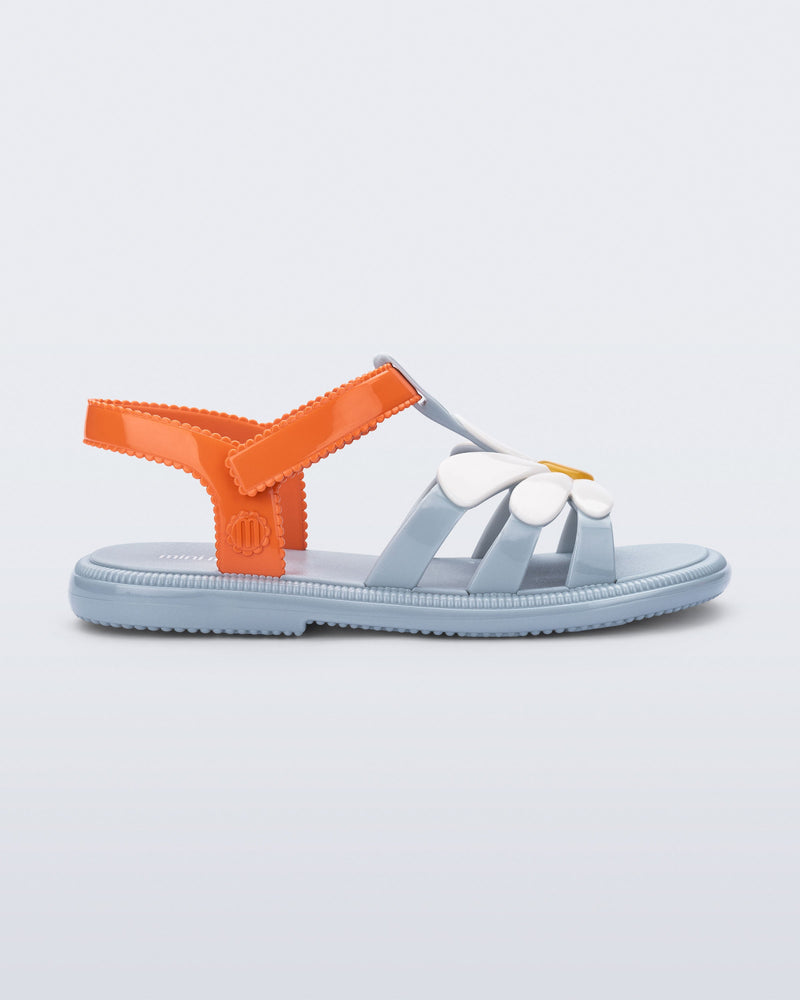 Side view of a kids blue and orange Hip Bloomy sandal