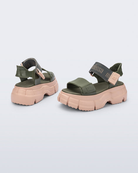 Back and side view of a pair green Pulse platform sandals with straps and pink sole