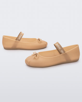 Angled view of a pair of Melissa Sophie ballet flats in black with M-logo strap and bow applique