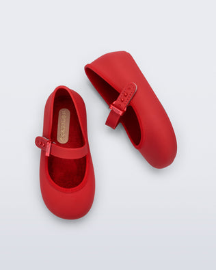 Top and side view of a pair of red Soft Ballerina baby flat with Velcro strap