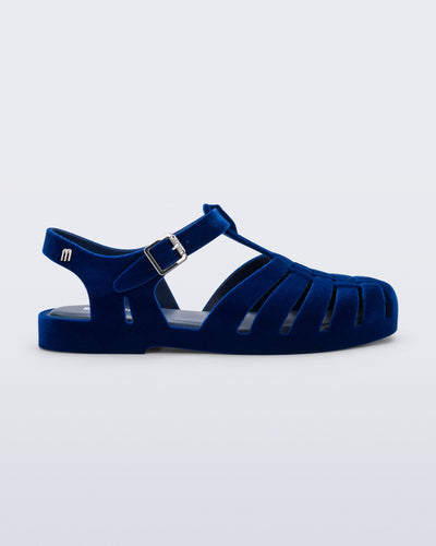 Side view of a flocked blue Possession Velvet fisherman sandal