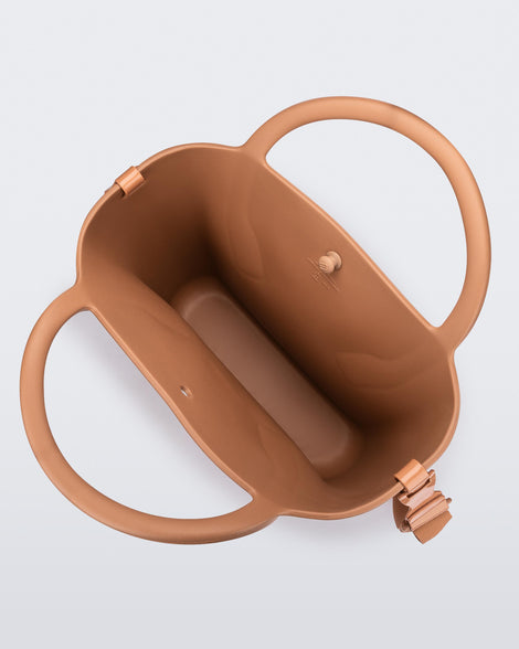 Top view of a brown Free Big Bag with handles and a strap