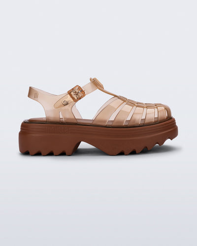 Side view of a transparent brown Possession Platform II fisherman sandal