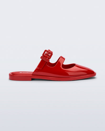 Side view of a red Anastasia mule slide with upper straps