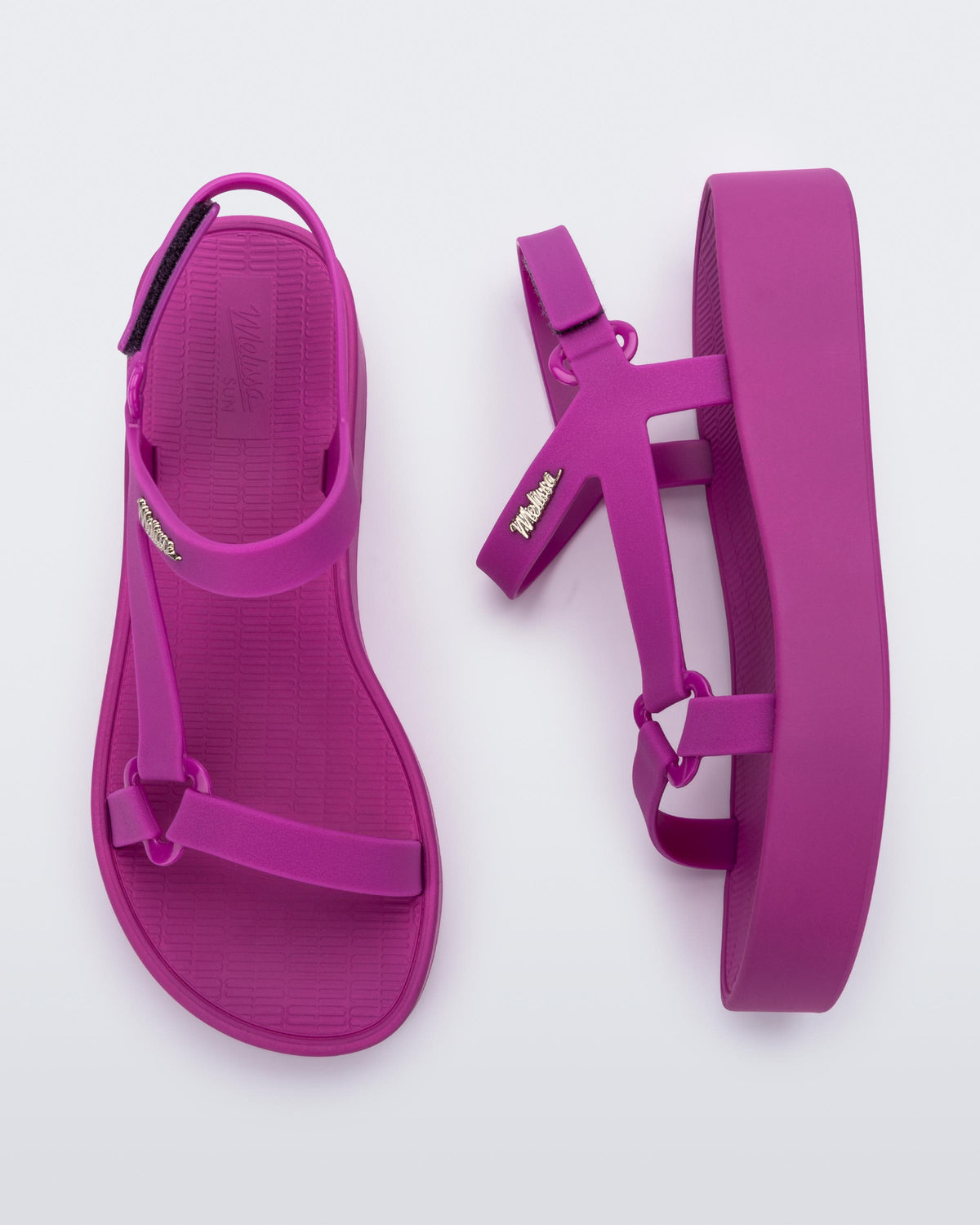 Top and side view of a pair of dark pink Sun Downtown Platform sandals