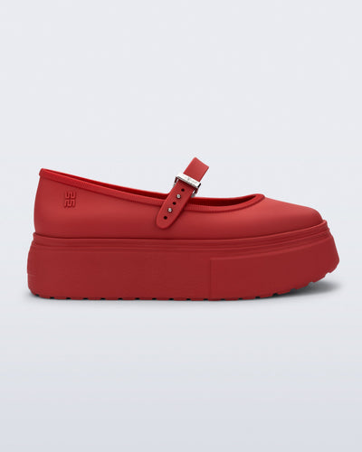 Side view of a red Soft Ballerina Platform flats