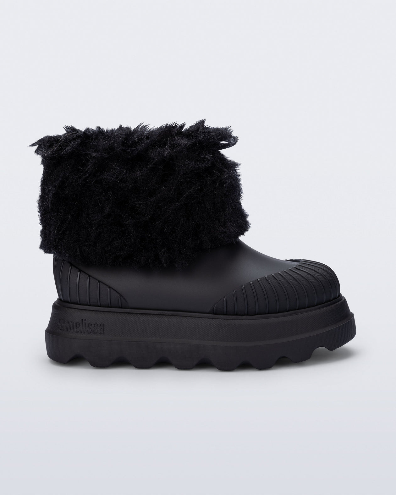 Side view of a black Warm Boot with fuzzy cuff and inside