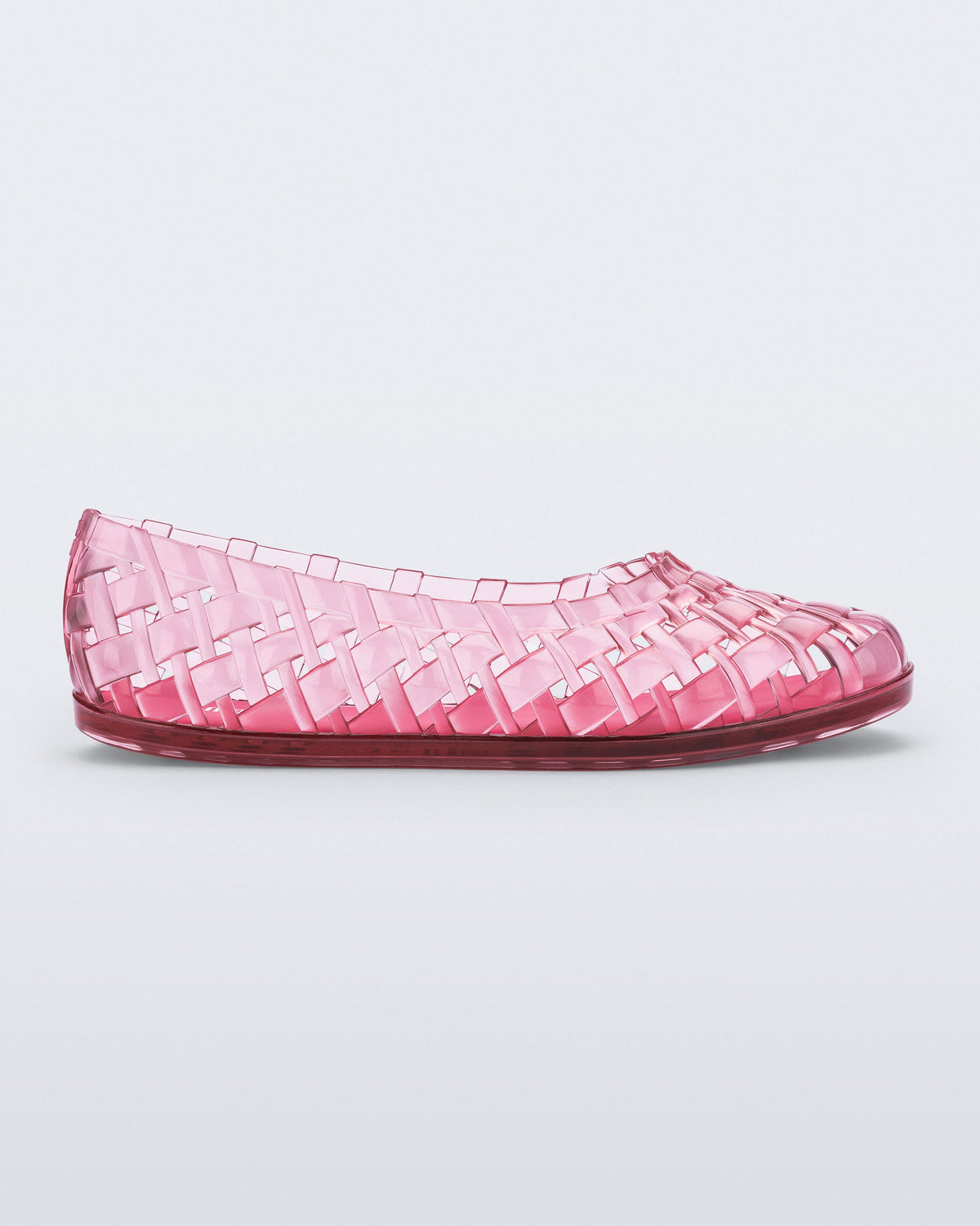 Side view of a clear pink Possession Ballerina flat