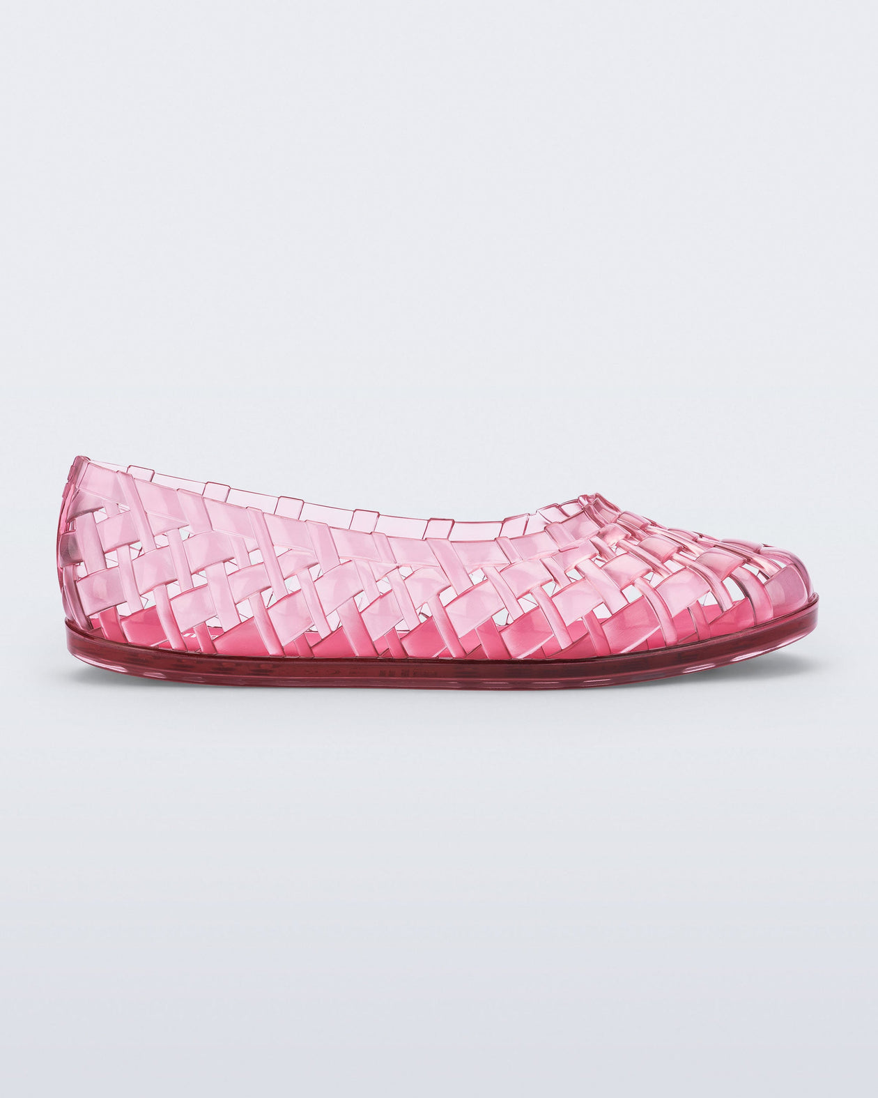 Side view of a clear pink Possession Ballerina flat