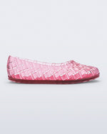 Side view of a clear pink Possession Ballerina flat