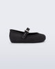 Side view of a black Soft Ballerina baby flat with Velcro strap