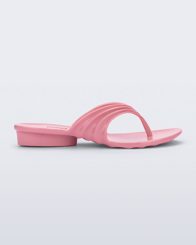 Side view of a pink Flip Flop + Diesel sandals