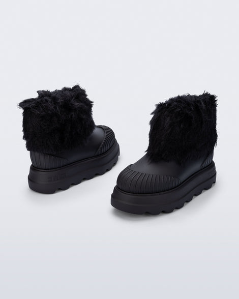 Back and angled view of a pair of black Warm Boot with fuzzy cuff and insole