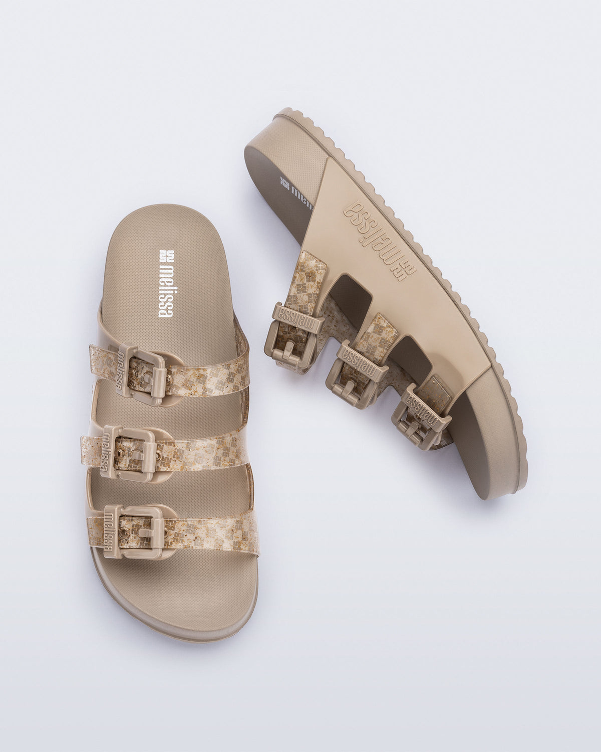 Top and side view of a pair of beige Cozy Stripes slides
