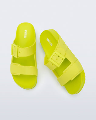Top view of a pair of green Cozy Connection slides