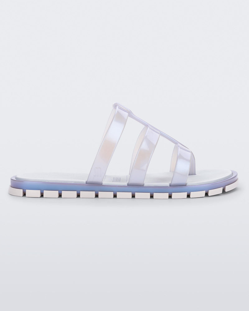 Side view of a pearly blue Path adult sandal with  blue sole