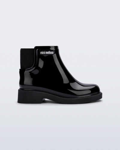 Side view of a black Chelsea II kids boot