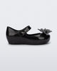 Side view of a black glitter Ultragirl Sweet baby ballerina flat with bow