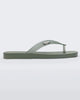Side view of green/clear Melissa Sun Long Beach flip flop with a green base and clear green straps with 
