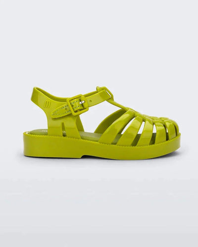 Side view of a green Mini Melissa Possession sandal with several straps and a green base.