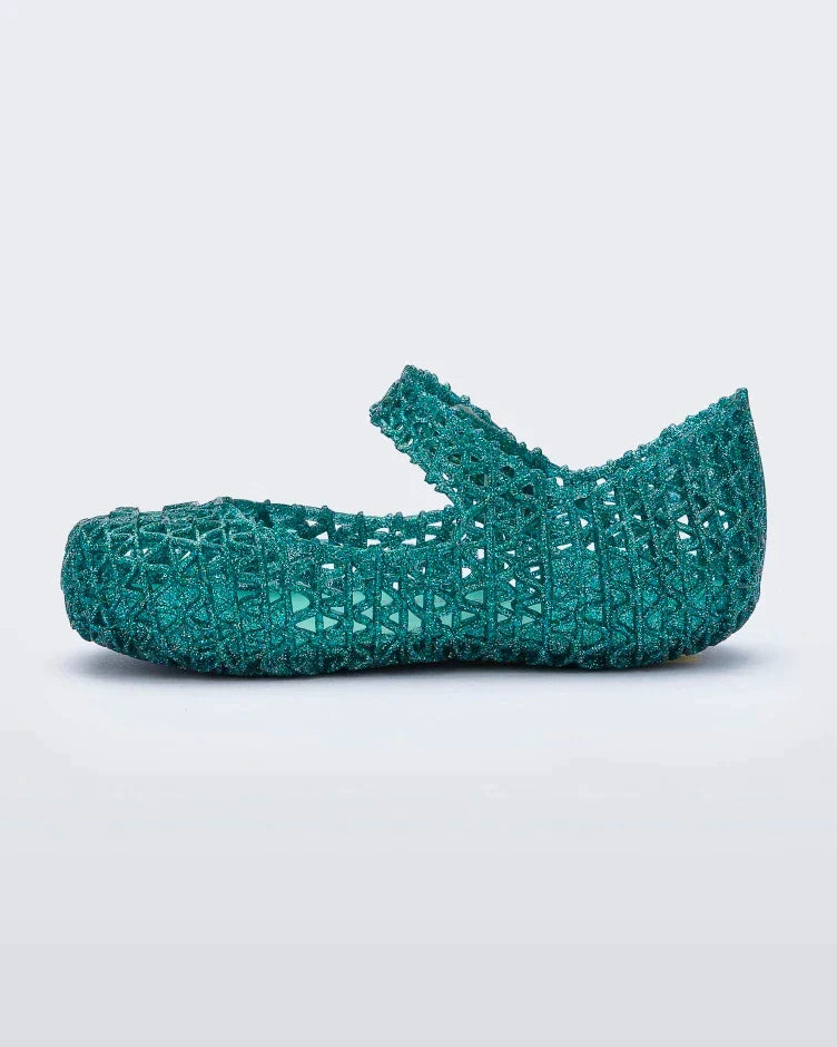 Inside view of Mini Melissa Campana green glitter flats with a snap strap for baby with an open woven texture