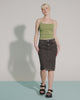 Video with no sound of a model in a green shirt and black skirt wearing a pair of black Kick Off Sandals.