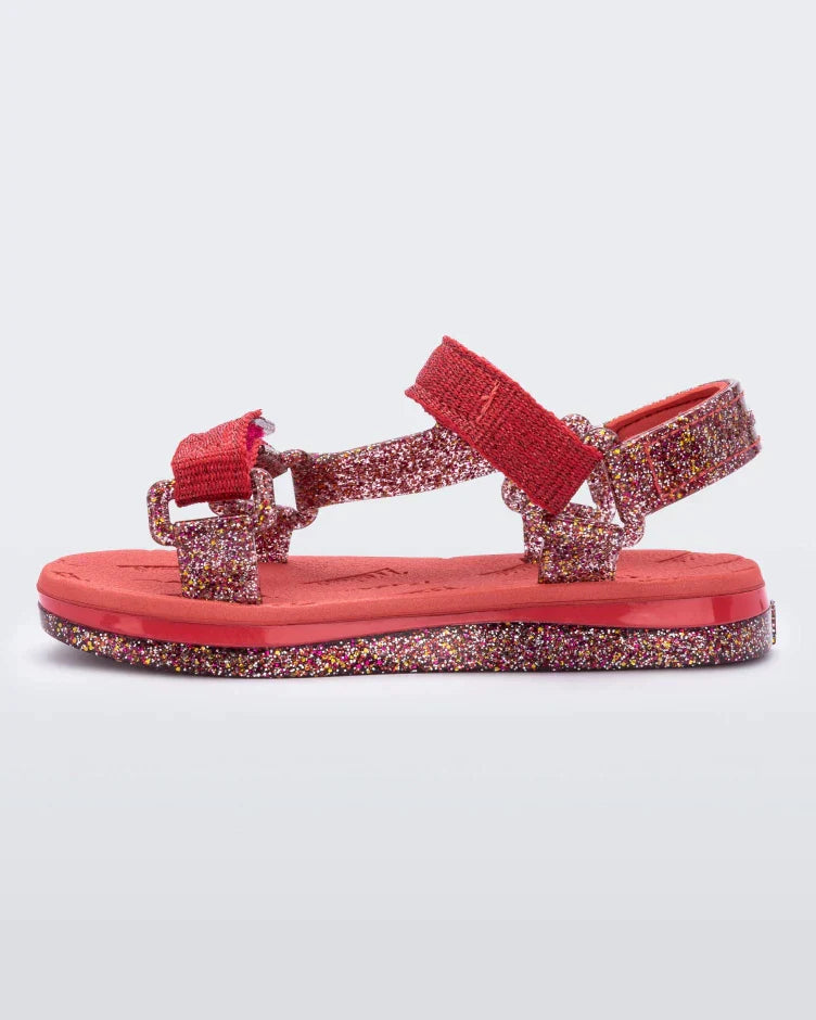 inside view of a red and glitter Mini Melissa Papete sandal.