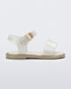 Side view of a white Mini Melissa Mar Sandal with two straps and a gold buckle.
