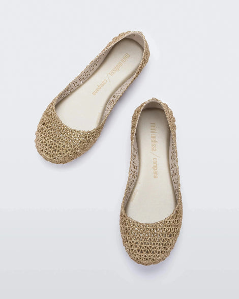Top view of a pair of white / gold glitter Mini Melissa Campana flats with an open woven texture.